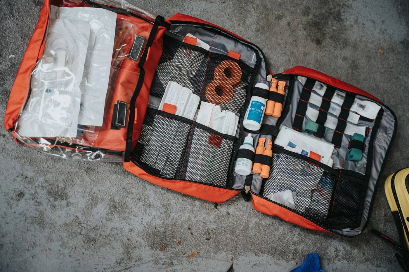 Open first aid kit with bandages antiseptic and medical supplies for mountain travel