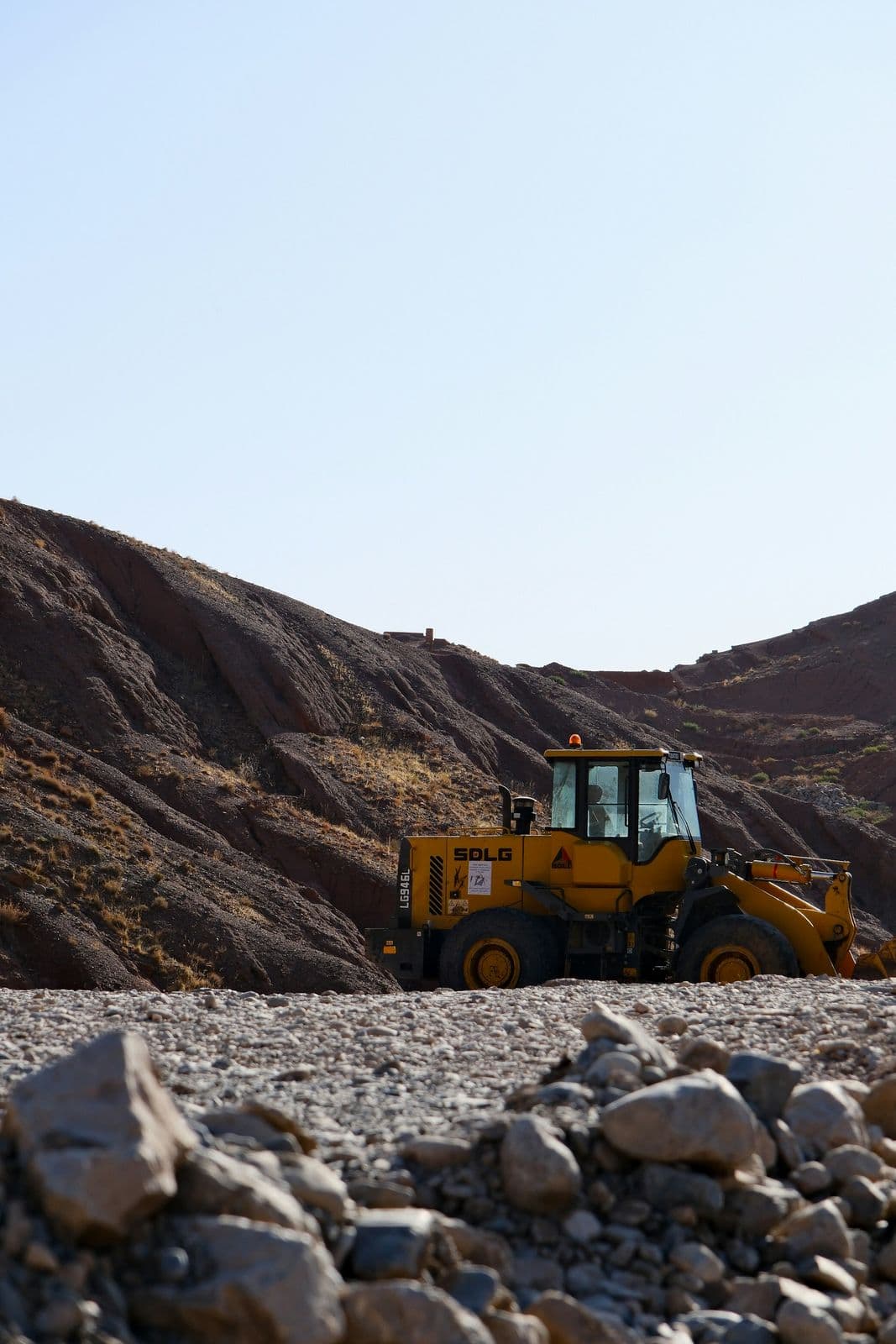 BRO heavy machinery clearing landslide debris on a mountain road in the Himalayas