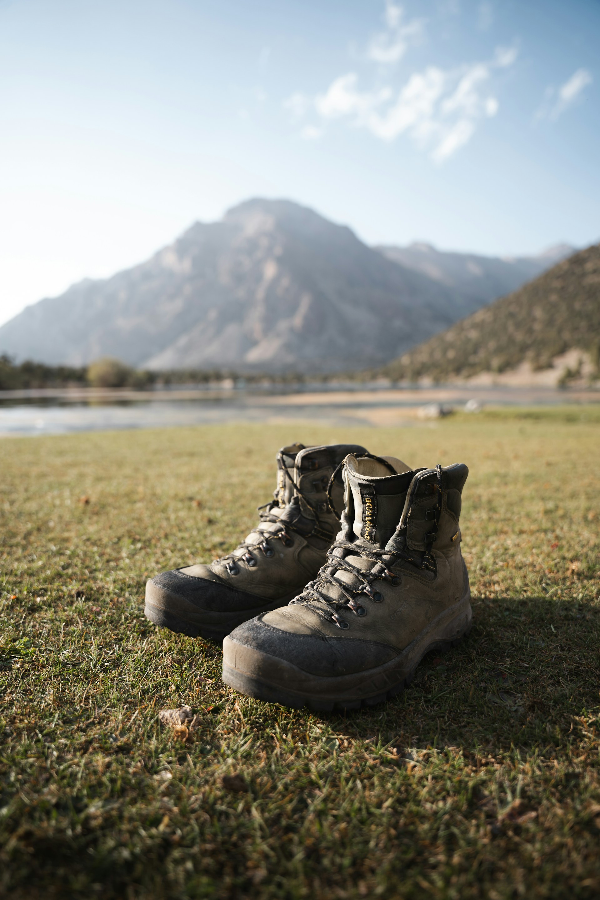 Close-up of trekking shoe outsole showing deep lug pattern for grip on rocky mountain terrain