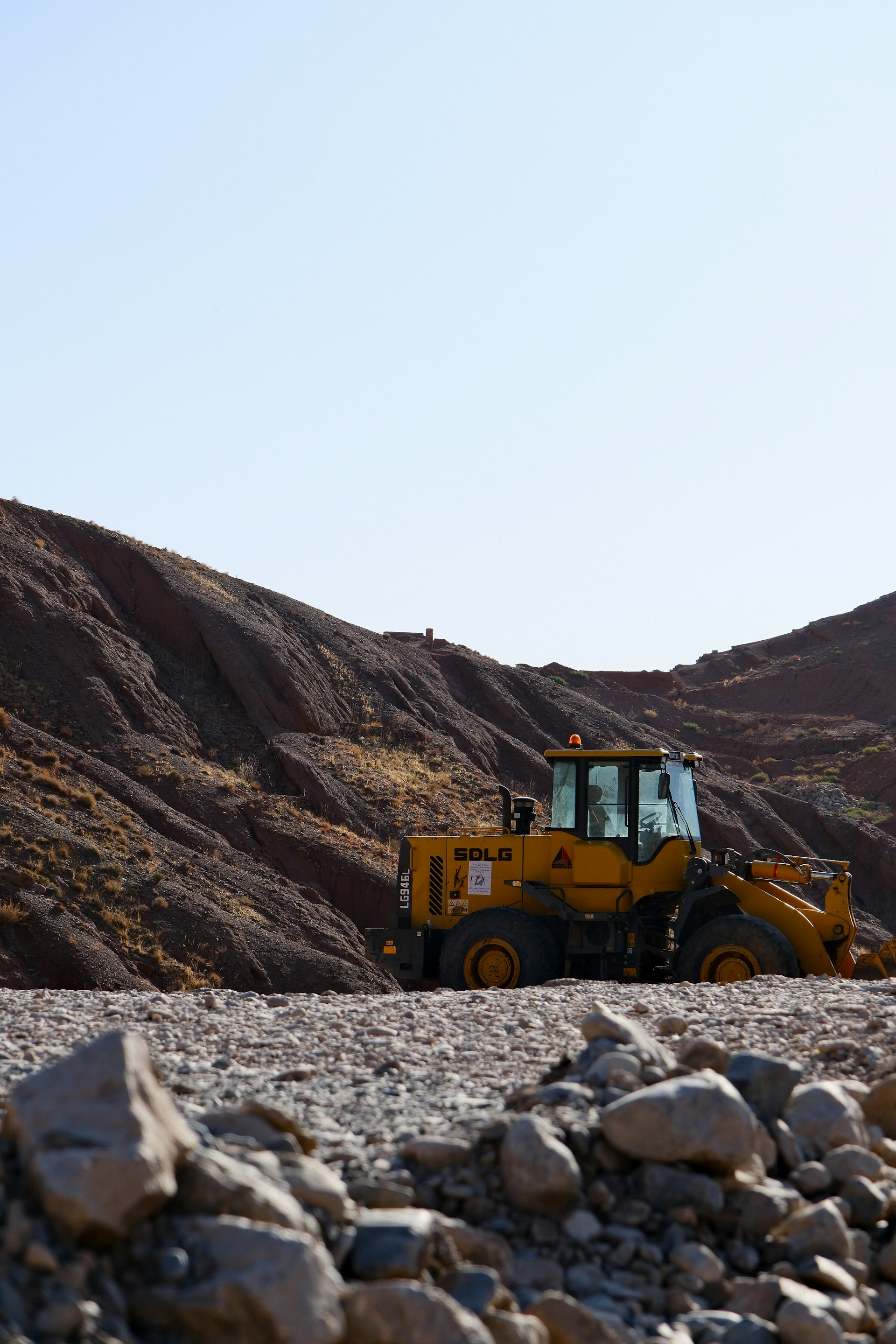 BRO heavy machinery clearing landslide debris on a mountain road in the Himalayas
